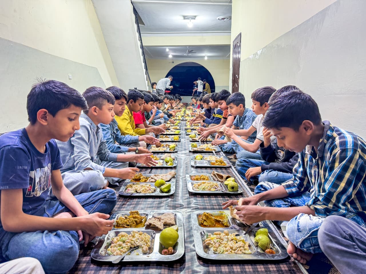 Kitchen staff preparing wholesome daily meals for 250+ children at the foundation