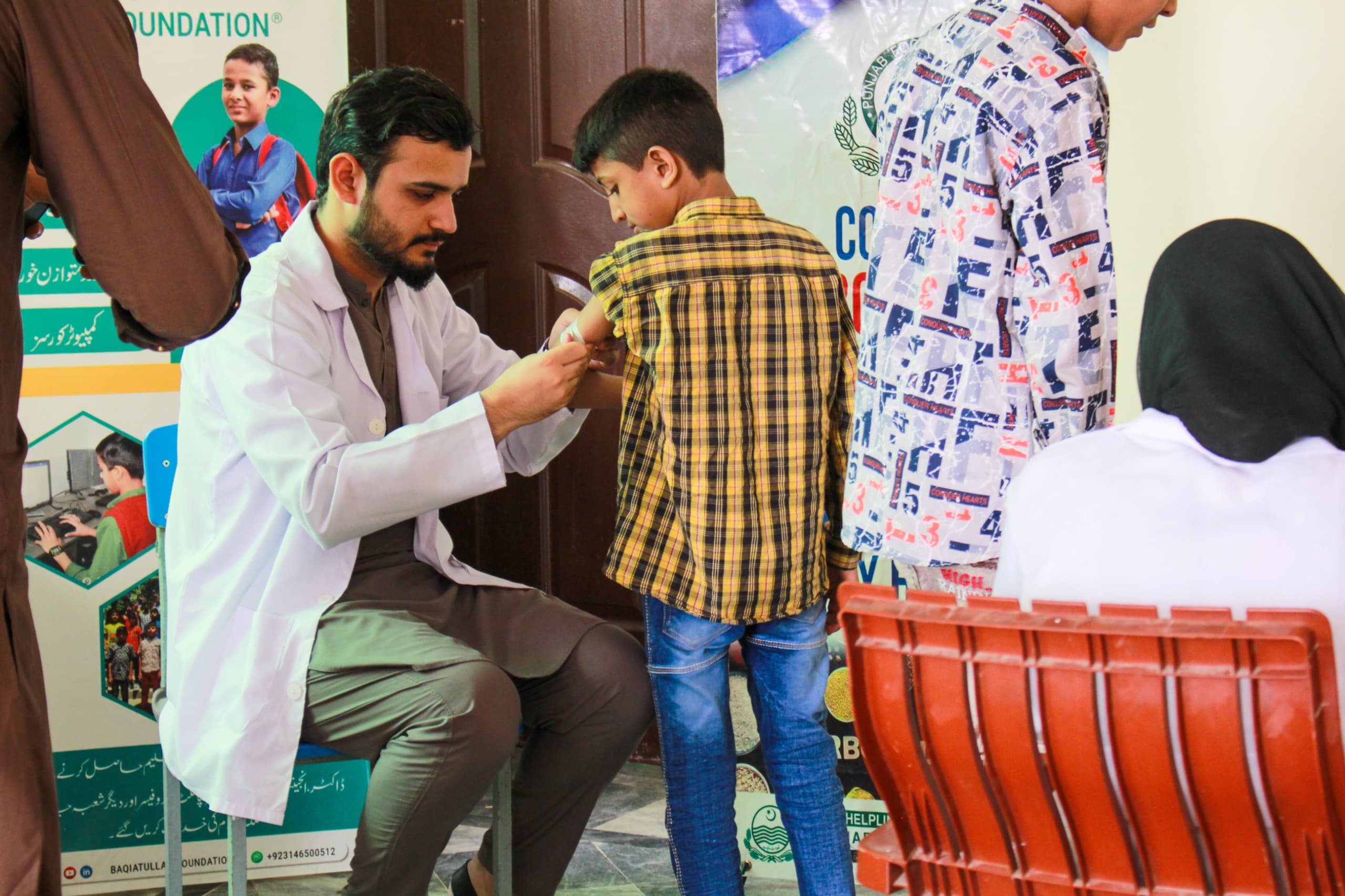 Eye screenings and free prescription eyewear distributed at Baqiatullah Foundation health camp
