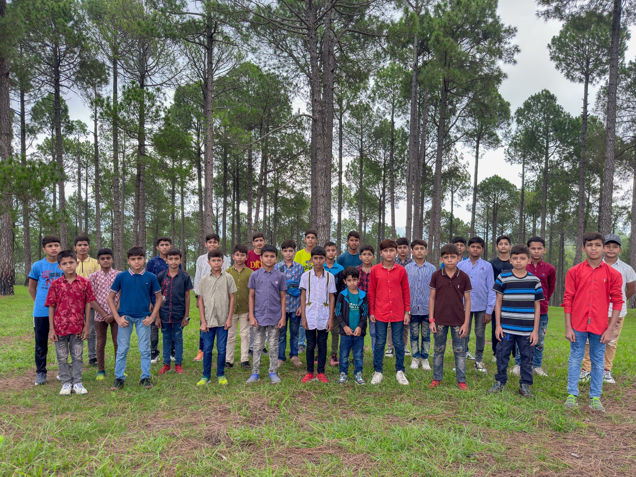 Children dressed in fresh school uniforms provided by Baqiatullah Foundation