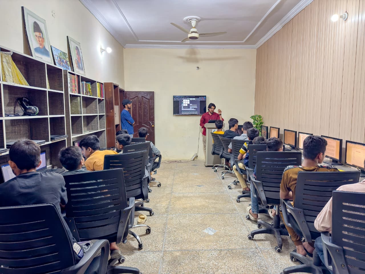 Young learners practising coding and web development at Baqiatullah Foundation