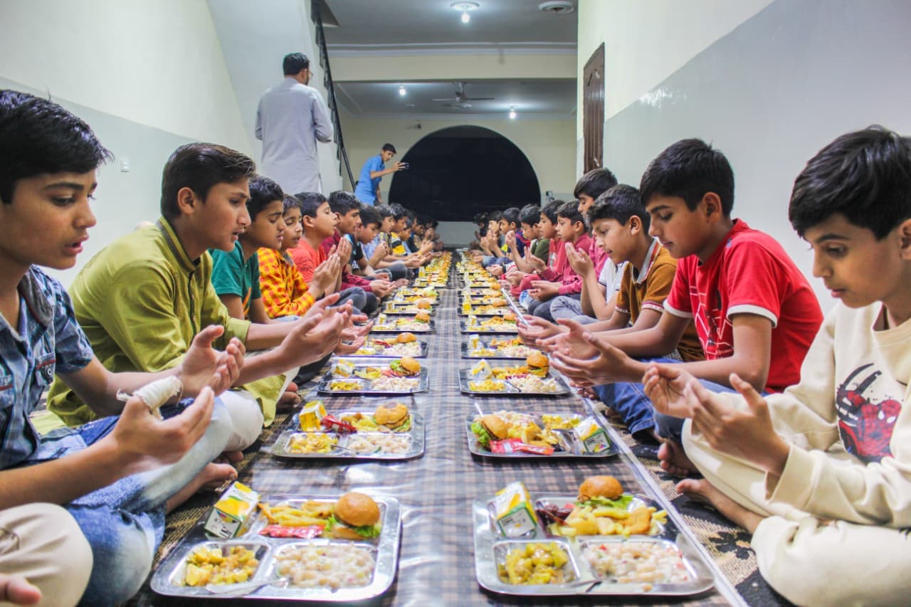 Children receiving maternal care and daily supervision at Baqiatullah Foundation orphanage